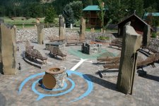 Stone-Circle-at-White-Mountain-Druid-Sanctuary-with-fire-pit-in-the-center-and-the-well-at-the-w.jpg